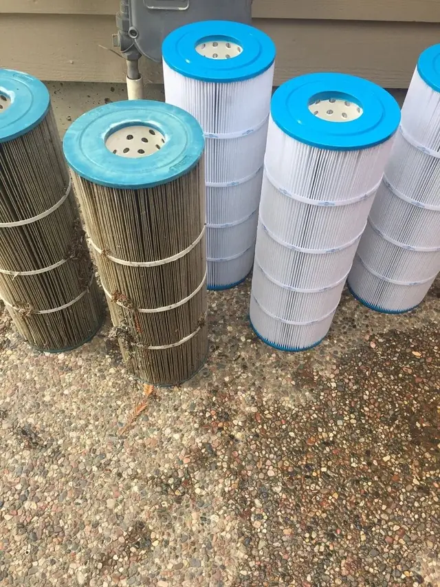 A used filter cartridge beside a clean one